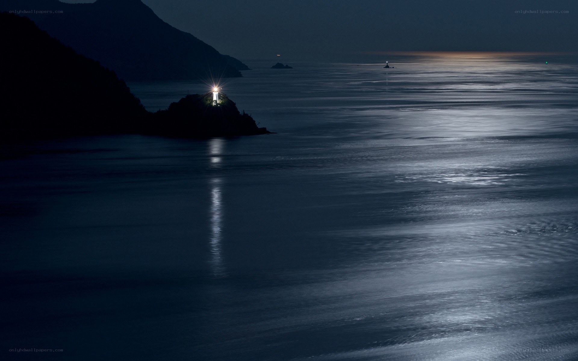 Lighthouse at night on the coast