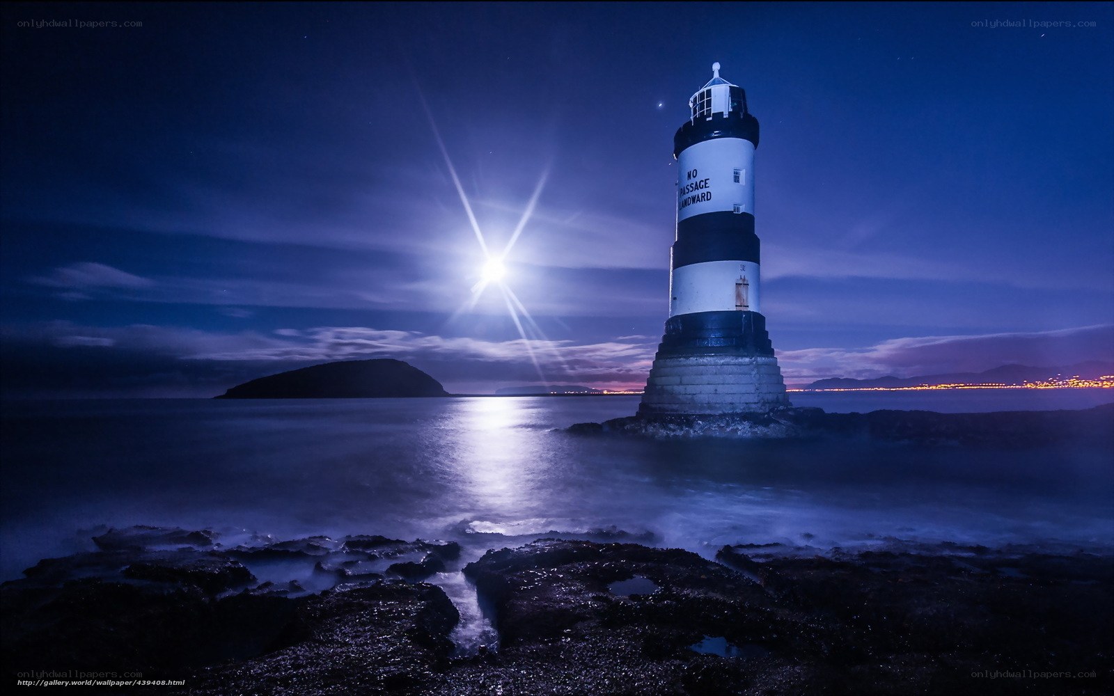 Lighthouse at night with moon