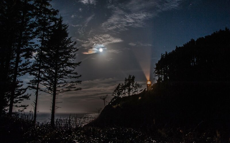 Lighthouse at night with moon