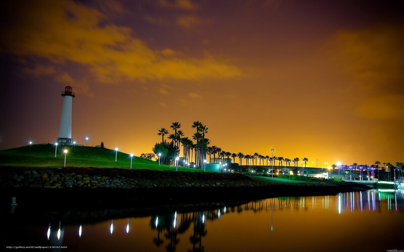 Lighthouse at night with reflections