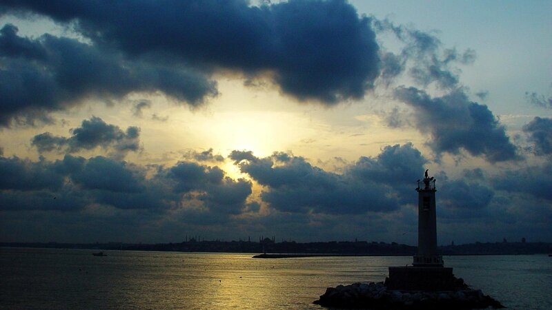 Lighthouse at Sunset — Blue, Dramatic, Photograph, Clouds