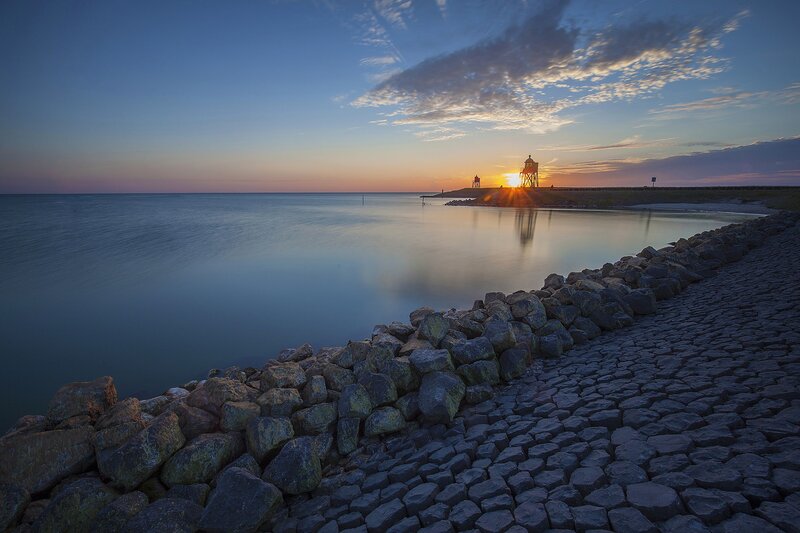 Lighthouse at Sunset — Blue, Serene, Photograph, Sea, Rocks