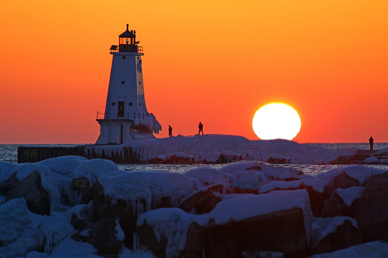 Lighthouse at sunset in winter