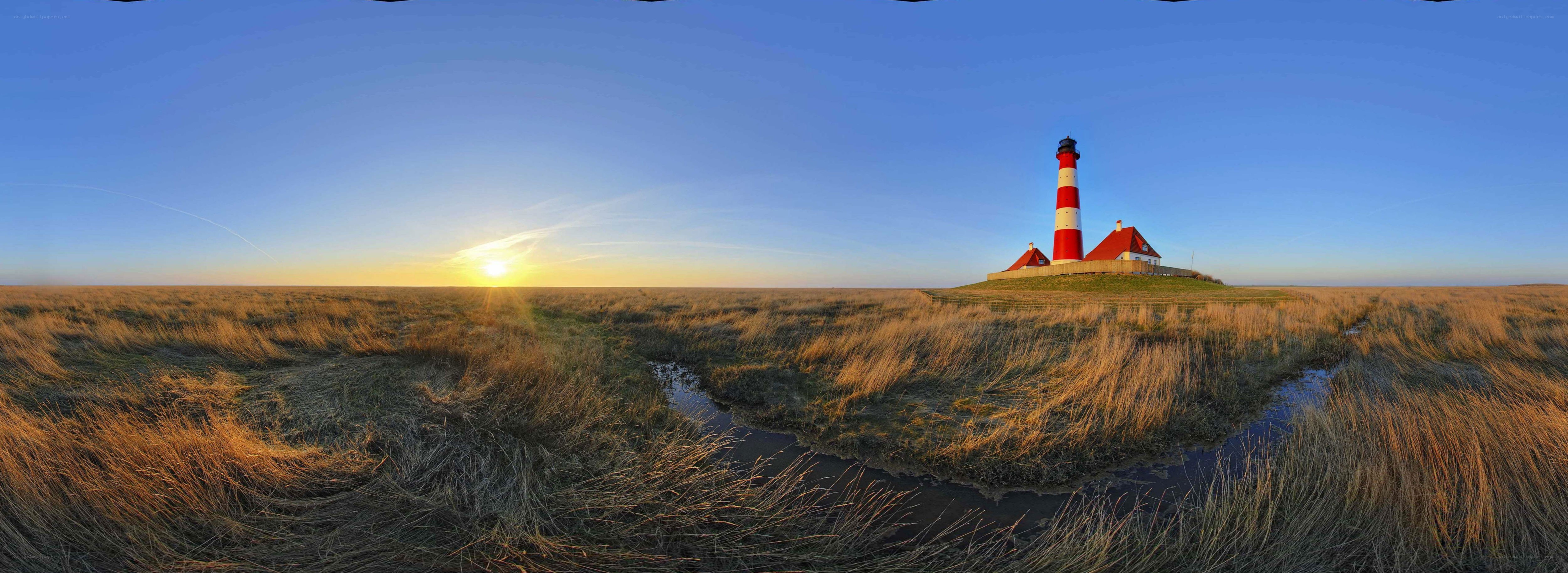 Lighthouse at sunset on a marsh