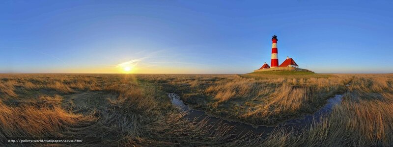 Lighthouse at sunset on a marsh