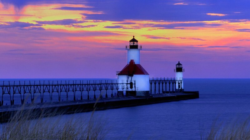 Lighthouse at sunset on a pier