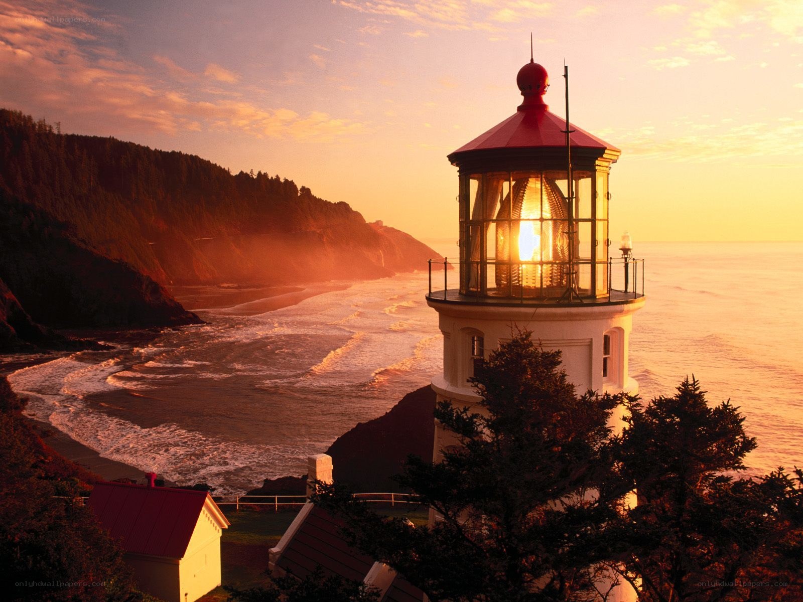 lighthouse at sunset on coast