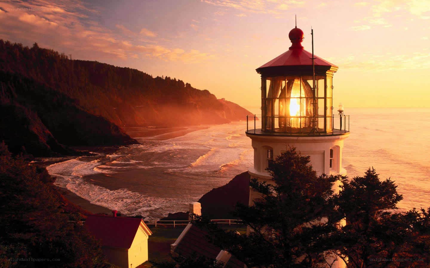 lighthouse at sunset on coast