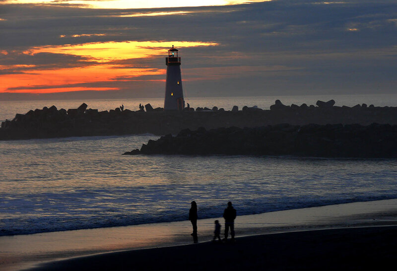 Lighthouse at sunset on the beach