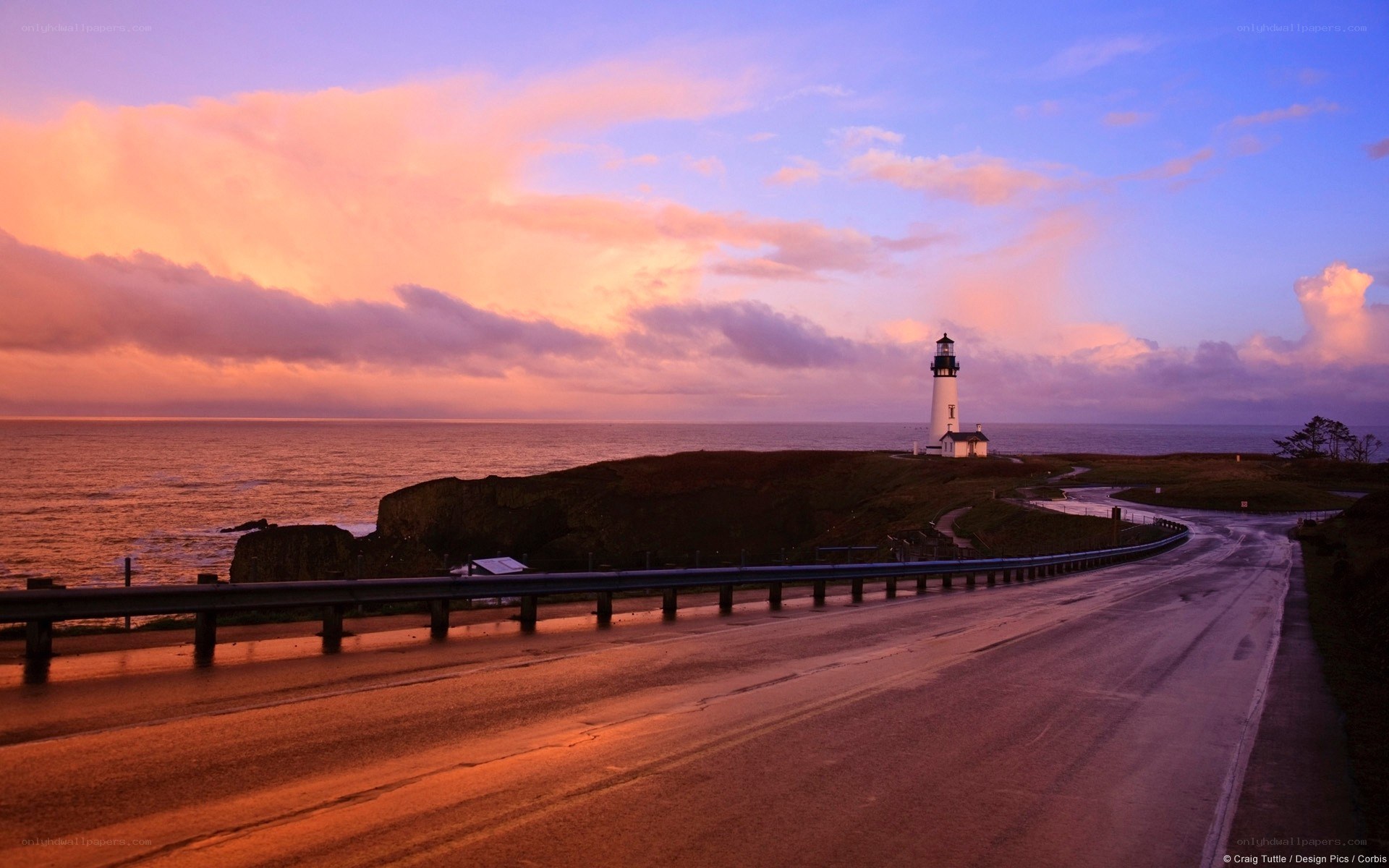lighthouse at sunset on the coast