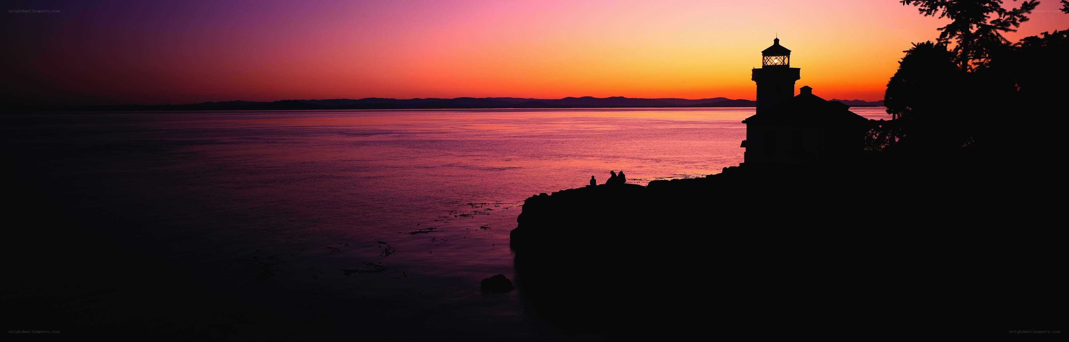 Lighthouse at sunset on the coast