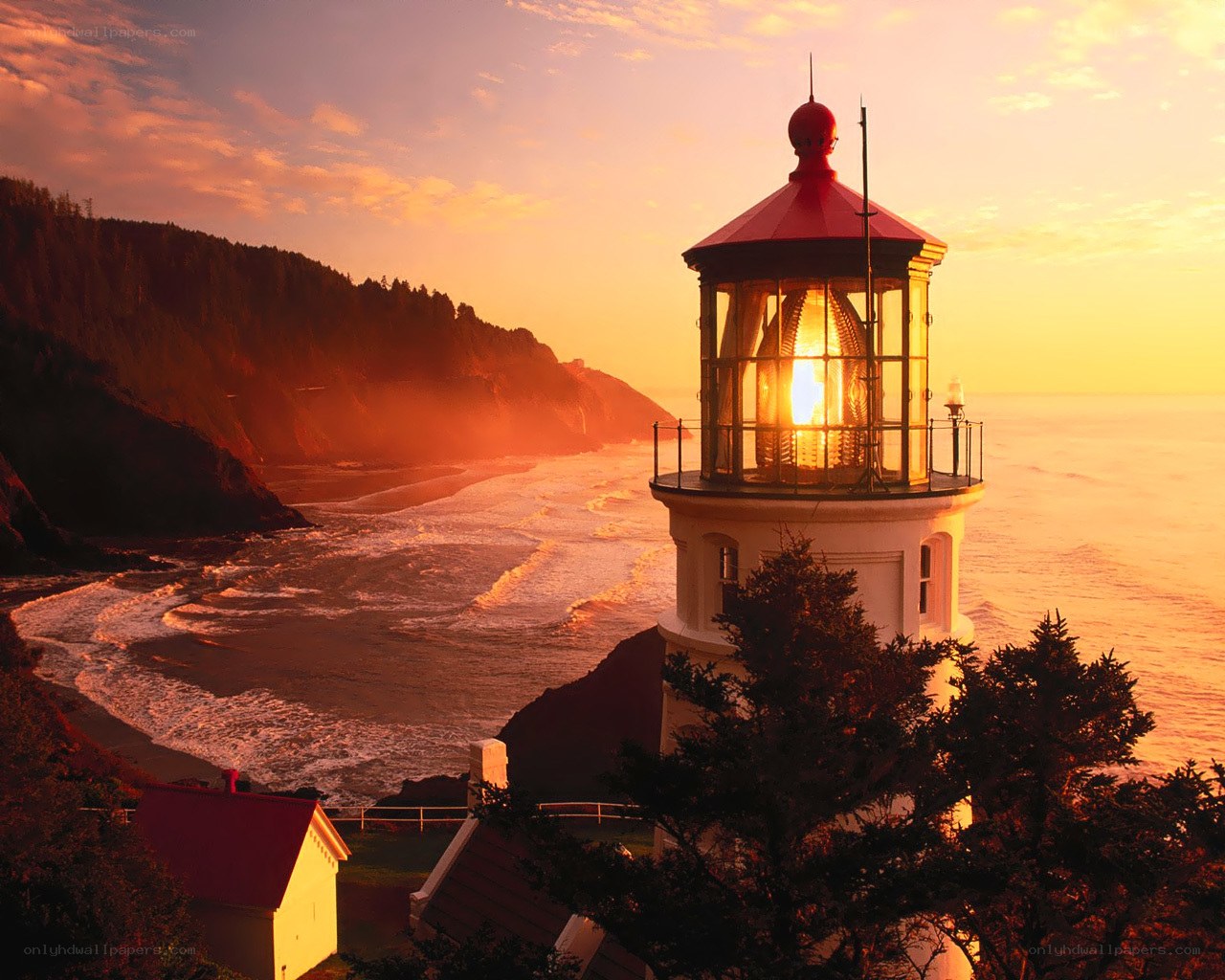 Lighthouse at sunset on the coast