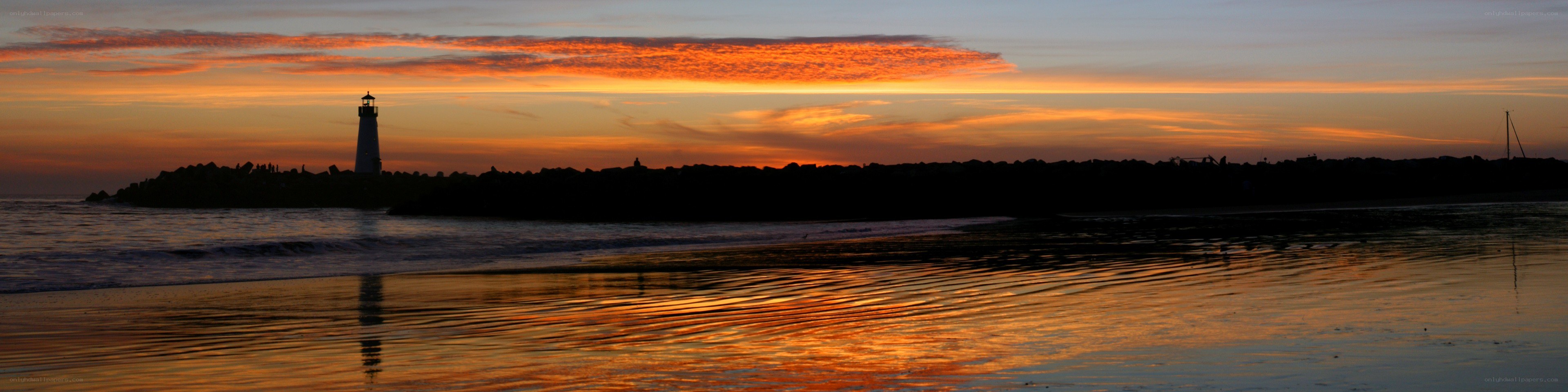 Lighthouse at sunset on the coast