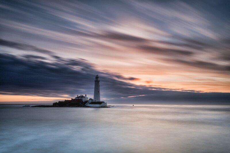 Lighthouse at sunset on the coast