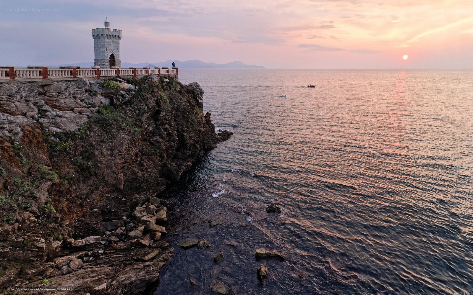 Lighthouse at sunset on the coast