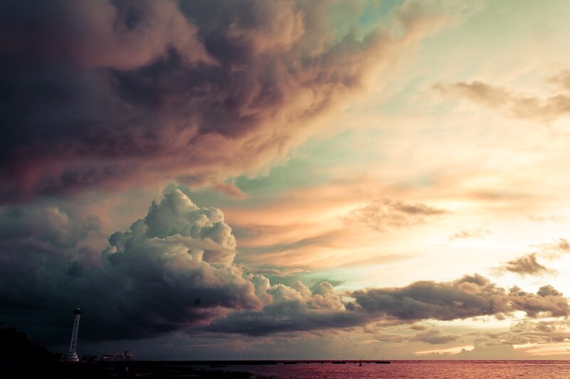 Lighthouse at Sunset — Orange, Dramatic, Photograph, Clouds