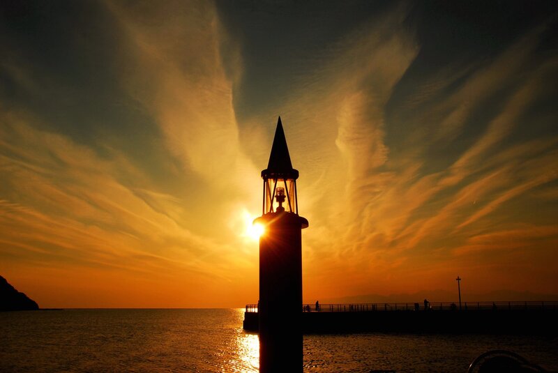 Lighthouse at Sunset — Orange, Dramatic, Photograph, Sea, Sky, Pier, Yellow