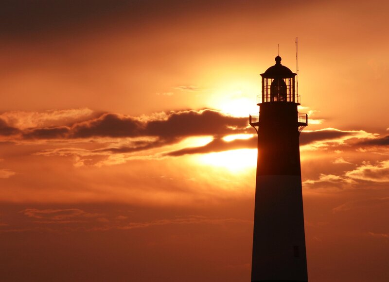 Lighthouse at Sunset — Orange, Dramatic, Photograph, Sun, Clouds, Sky