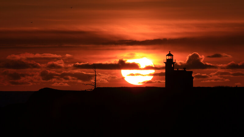 Lighthouse at Sunset — Orange, Dramatic, Photograph, Sun, Clouds