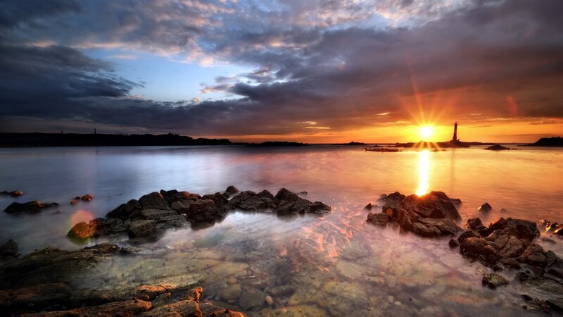 Lighthouse at Sunset — Orange, Dramatic, Photograph, Sun, Rocks, Sea