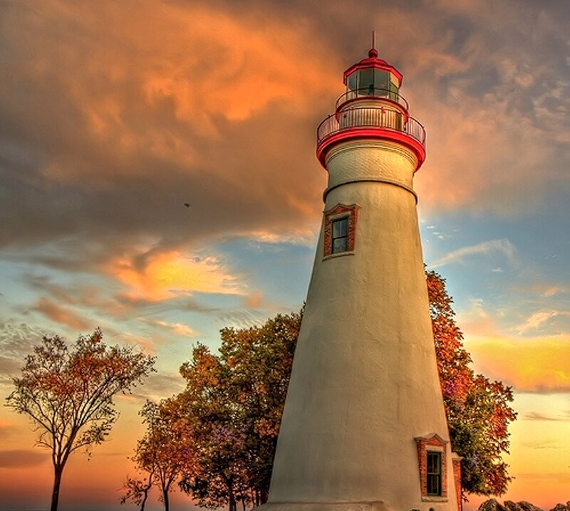Lighthouse at Sunset — Orange, Dramatic, Photograph, Trees