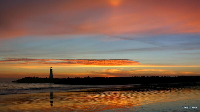 Lighthouse at Sunset — Orange, Serene, Photograph, Beach, Ocean, Sky, Blue