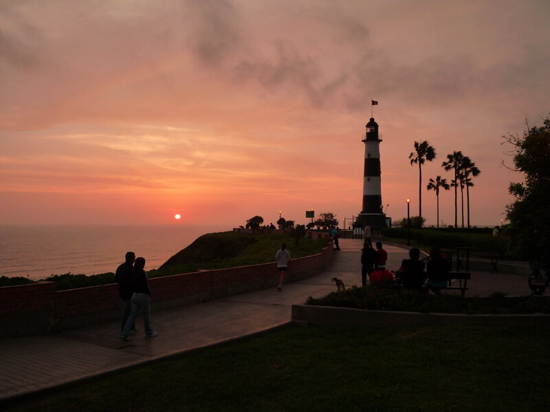 Lighthouse at Sunset — Orange, Serene, Photograph, Ocean, Palm Trees