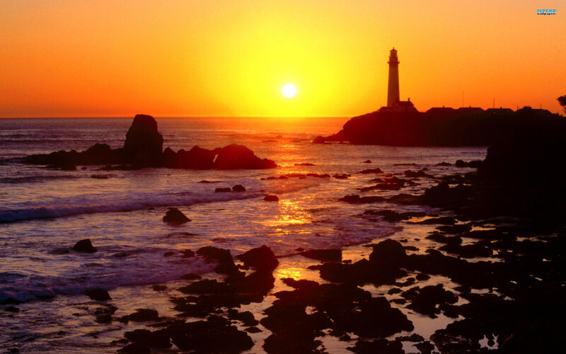 Lighthouse at Sunset — Orange, Serene, Photograph, Ocean, Rocks, Sun