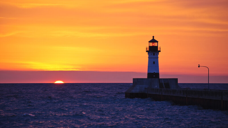 Lighthouse at Sunset — Orange, Serene, Photograph, Ocean, Sun