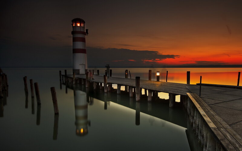Lighthouse at Sunset — Orange, Serene, Photograph, Pier, Water