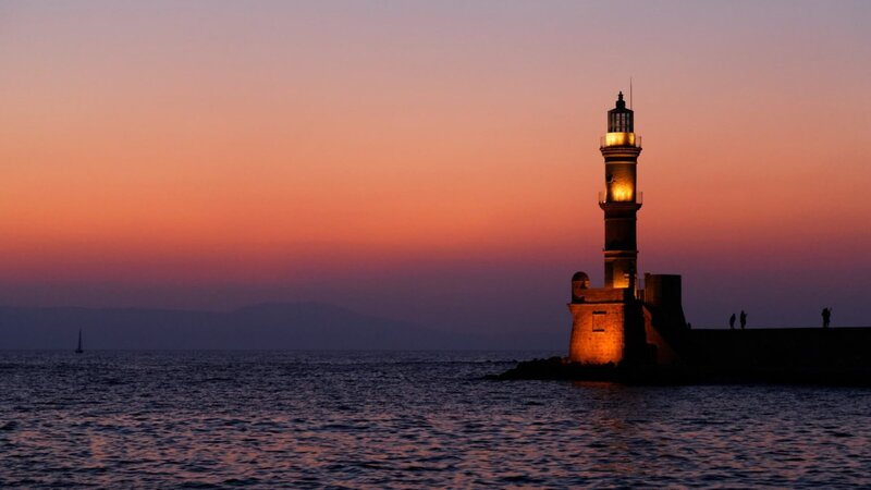 Lighthouse at Sunset — Orange, Serene, Photograph, Sea, Sky, People