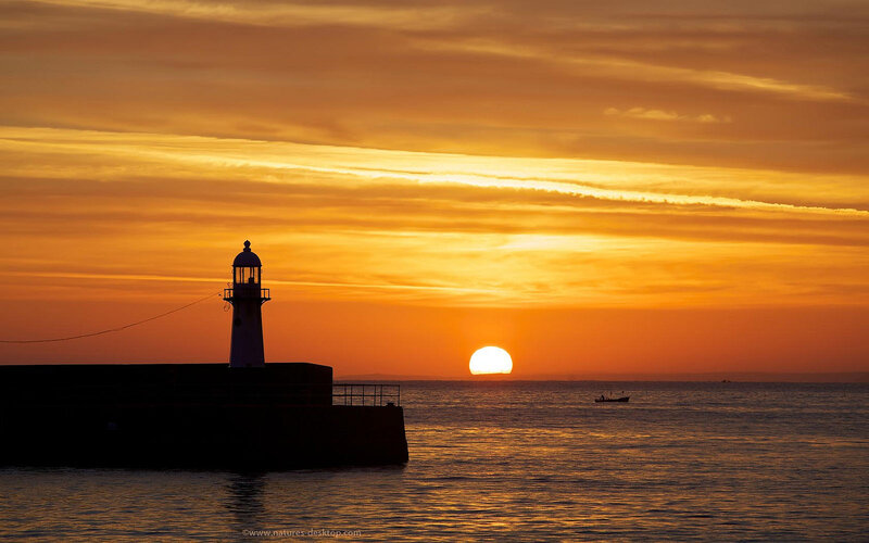 Lighthouse at Sunset — Orange, Serene, Photograph, Sun, Boat