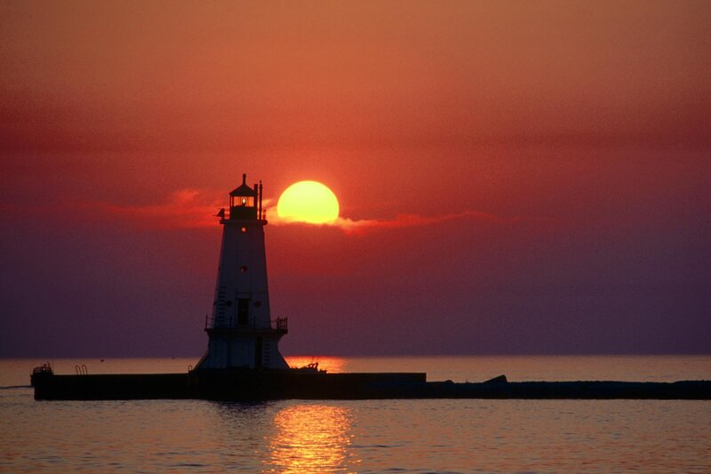Lighthouse at Sunset — Orange, Serene, Photograph, Sun, Ocean, Pier