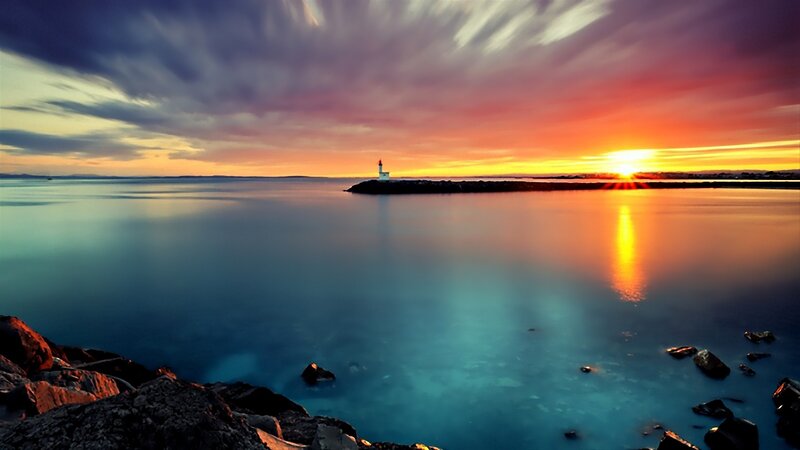 Lighthouse at Sunset — Orange, Serene, Photograph, Sun, Sea