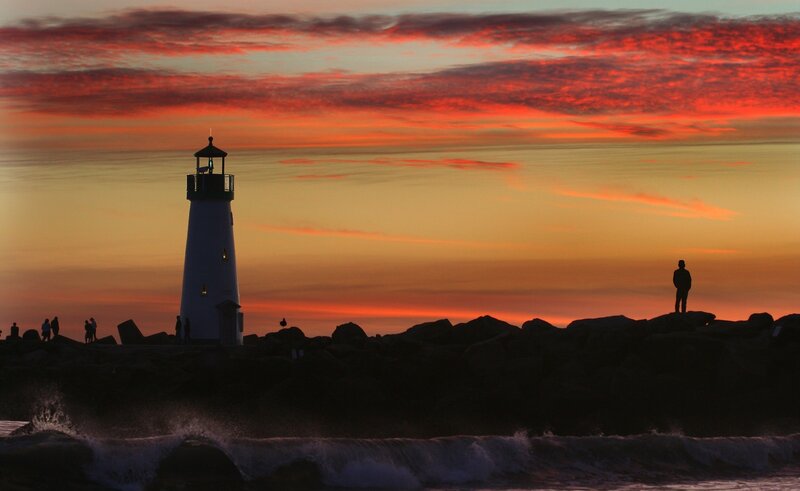 Lighthouse at Sunset — Red, Dramatic, Photograph, People, Rocks, Ocean
