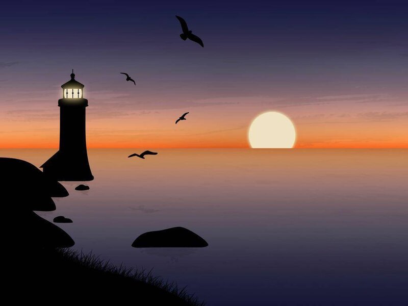 Lighthouse at sunset with birds