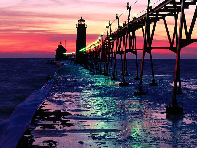 lighthouse at sunset with ice