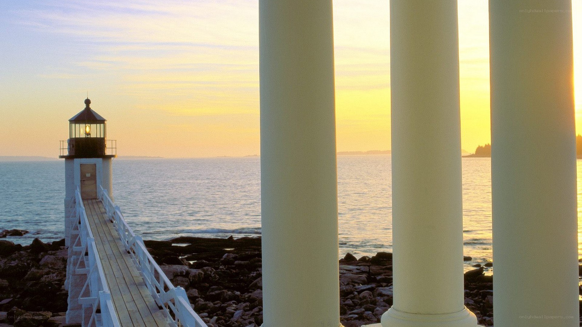 Lighthouse at sunset with pillars
