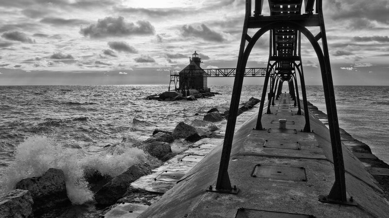 lighthouse at the end of a pier
