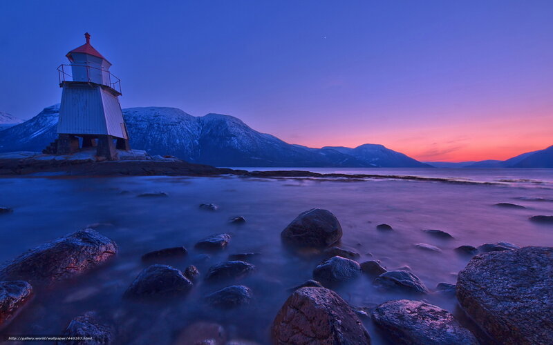 Lighthouse at twilight by the sea
