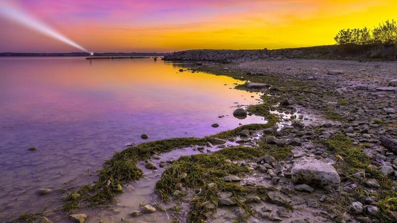 Lighthouse Beam at Sunset