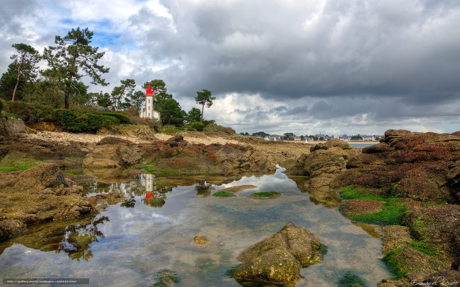 Lighthouse by the rocky shore