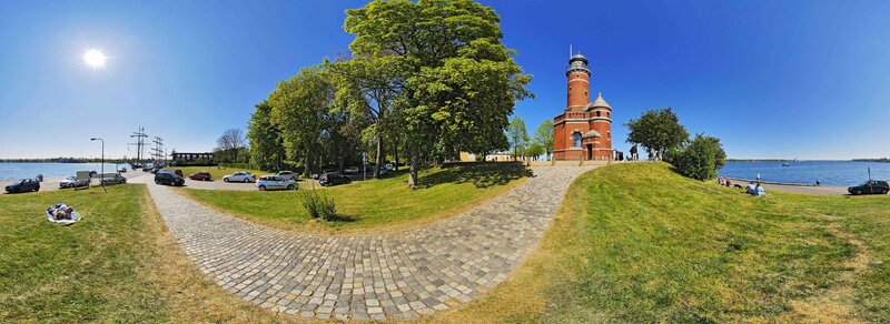 Lighthouse by the sea on a sunny day