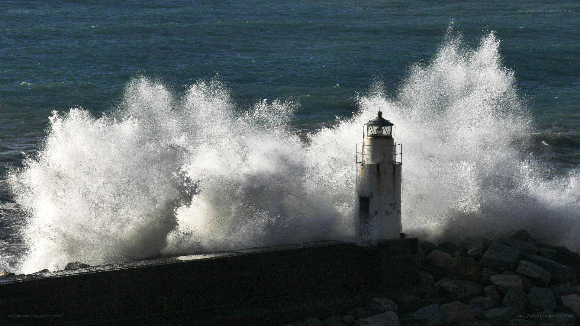 Lighthouse hit by crashing waves