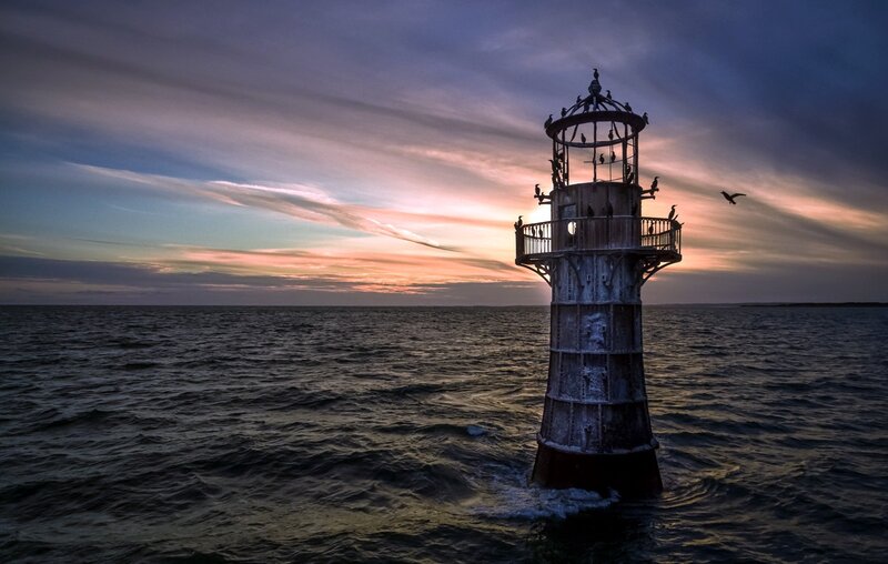 Lighthouse in Ocean — Blue, Dramatic, Sunset