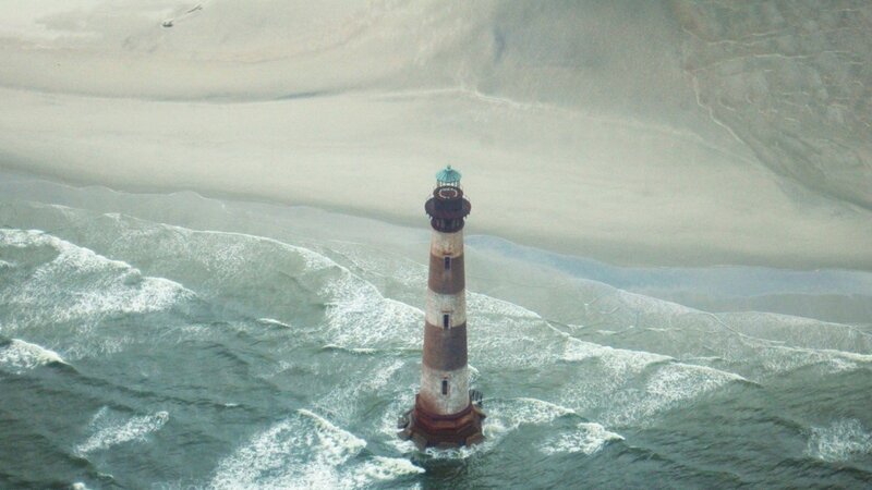 Lighthouse in Ocean — Gray, Dramatic