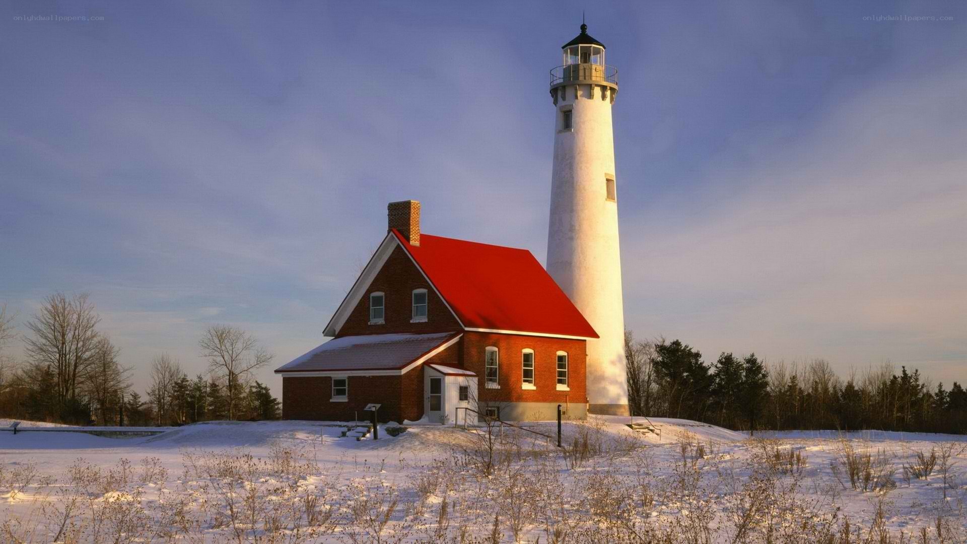 Lighthouse in snowy landscape