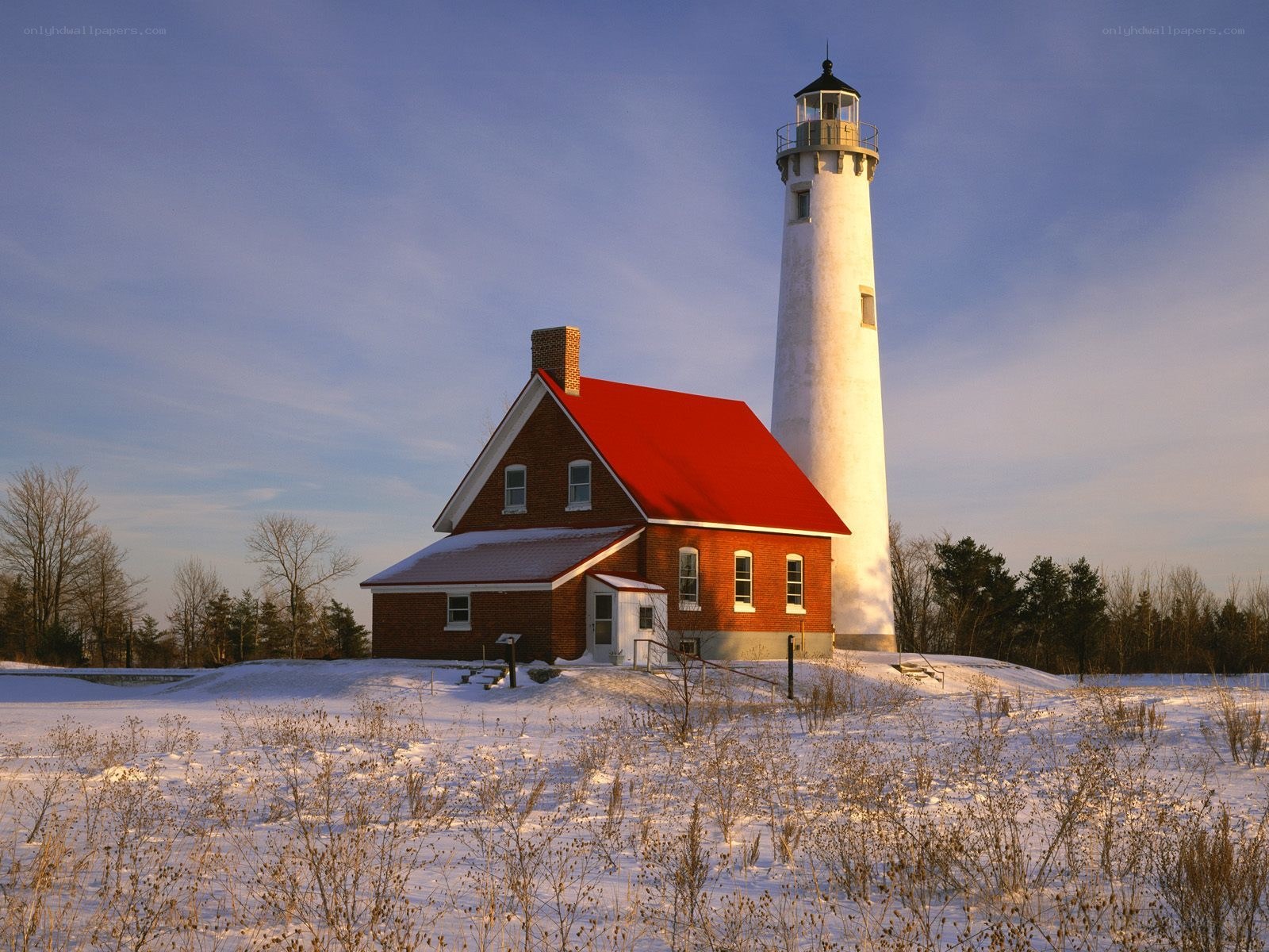 Lighthouse in snowy landscape