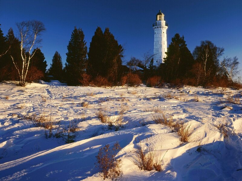 Lighthouse in snowy landscape