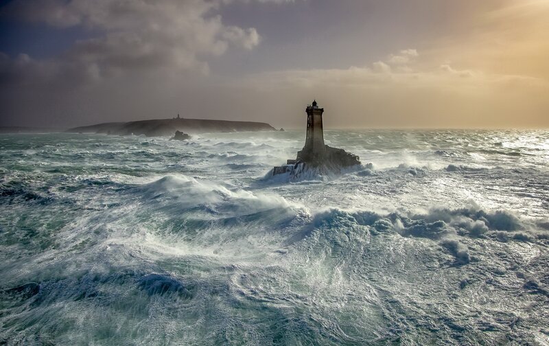 Lighthouse in Stormy Sea — Blue, Dramatic, Sunset